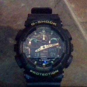 A G-Shock Watch: Black with gold on top